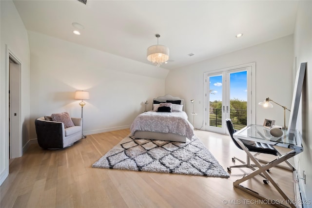 bedroom featuring light wood-type flooring, access to outside, baseboards, and recessed lighting