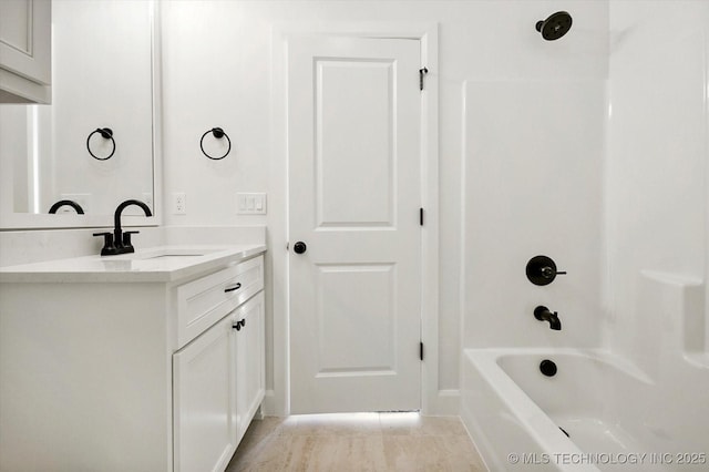 bathroom with vanity and bathtub / shower combination