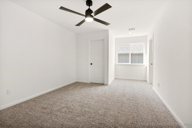 carpeted empty room with ceiling fan