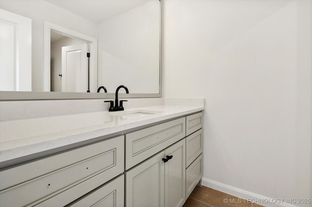 bathroom with tile patterned floors and vanity