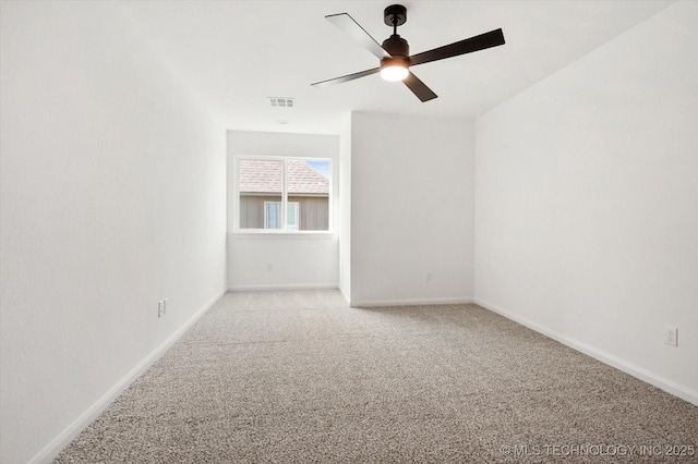 unfurnished room featuring ceiling fan and light carpet