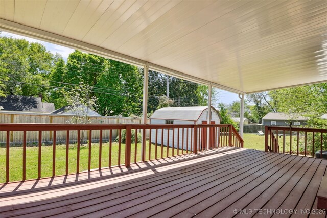 3006 E 21st St, Tulsa, OK 74114 - wooden terrace with a fenced backyard and a storage unit