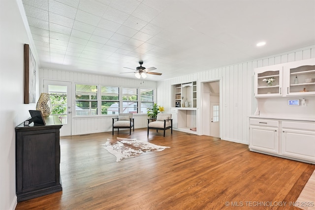 3006 E 21st St, Tulsa, OK 74114 - living area with wood finished floors and ceiling fan