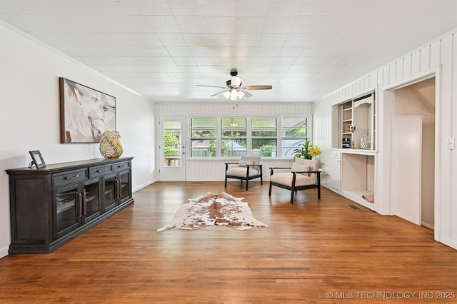 3006 E 21st St, Tulsa, OK 74114 - living area with ceiling fan, wood finished floors, and built in shelves