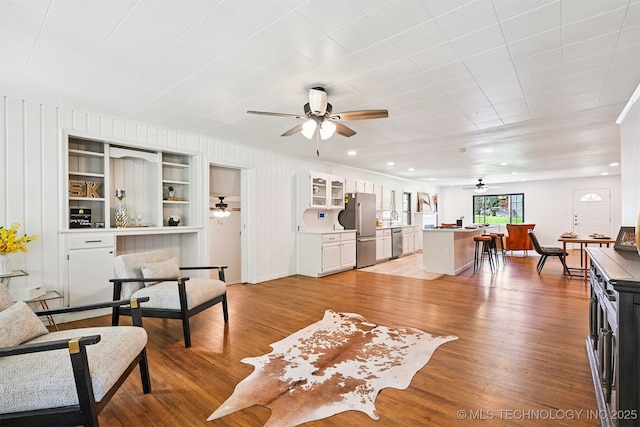 3006 E 21st St, Tulsa, OK 74114 - living room featuring ceiling fan and light wood-style flooring