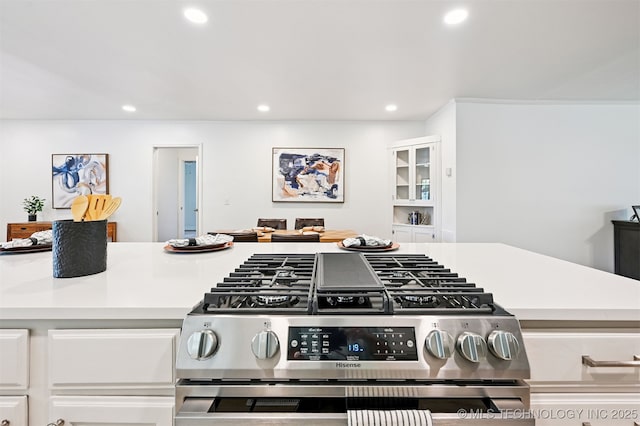 3006 E 21st St, Tulsa, OK 74114 - kitchen with gas stove, recessed lighting, white cabinetry, and light countertops