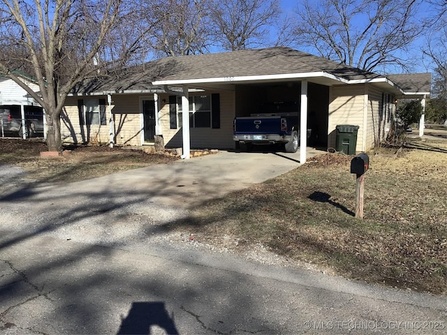 view of front of home featuring a carport