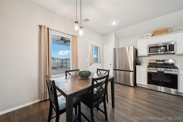 dining space featuring dark hardwood / wood-style floors