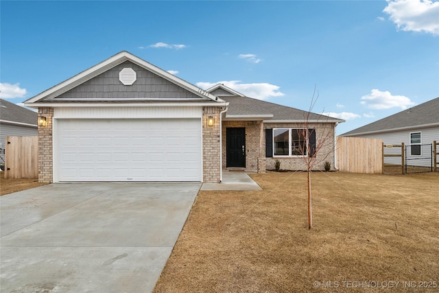 view of front of property featuring a garage and a front yard