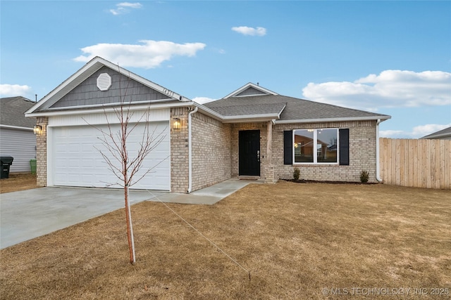 single story home with a garage and a front lawn