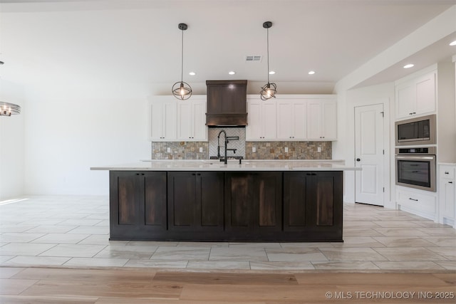 2044 E 129th Pl S, Jenks, OK 74037 - kitchen with appliances with stainless steel finishes, a sink, white cabinetry, light countertops, and backsplash