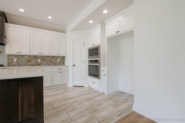 2044 E 129th Pl S, Jenks, OK 74037 - kitchen featuring appliances with stainless steel finishes, decorative backsplash, recessed lighting, light countertops, and white cabinets