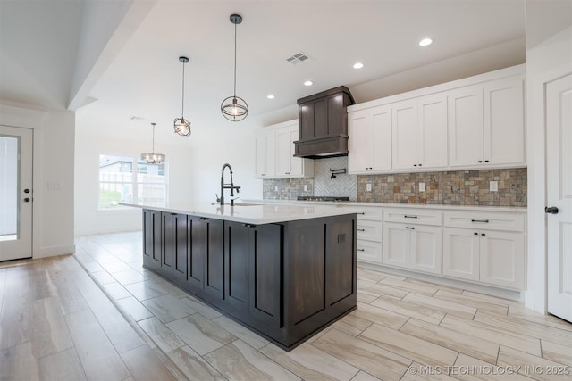 2044 E 129th Pl S, Jenks, OK 74037 - kitchen with a sink, light countertops, backsplash, gas stovetop, and recessed lighting