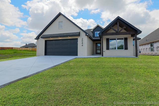 2044 E 129th Pl S, Jenks, OK 74037 - view of front facade with brick siding, driveway, and a garage