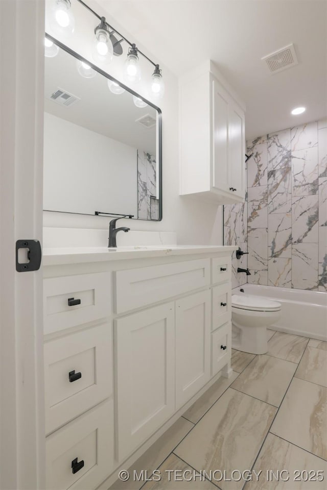 2044 E 129th Pl S, Jenks, OK 74037 - bathroom with vanity, toilet, marble finish floors,  shower combination, and recessed lighting