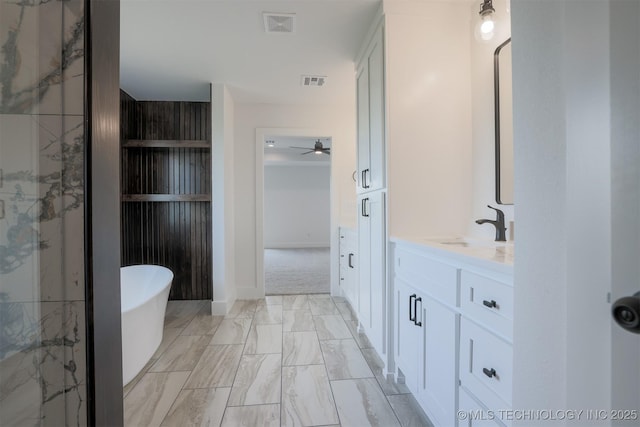 2044 E 129th Pl S, Jenks, OK 74037 - full bathroom featuring vanity, a soaking tub, a shower stall, marble finish flooring, and ceiling fan