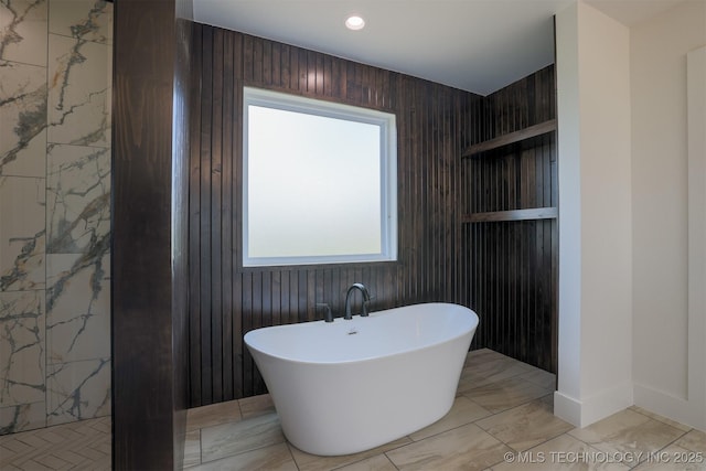 2044 E 129th Pl S, Jenks, OK 74037 - bathroom with a soaking tub, marble finish floors, and recessed lighting