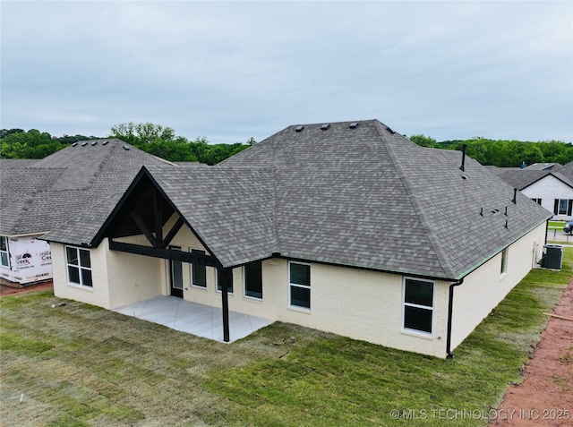 2044 E 129th Pl S, Jenks, OK 74037 - back of property with central air condition unit, roof with shingles, a patio area, and a lawn