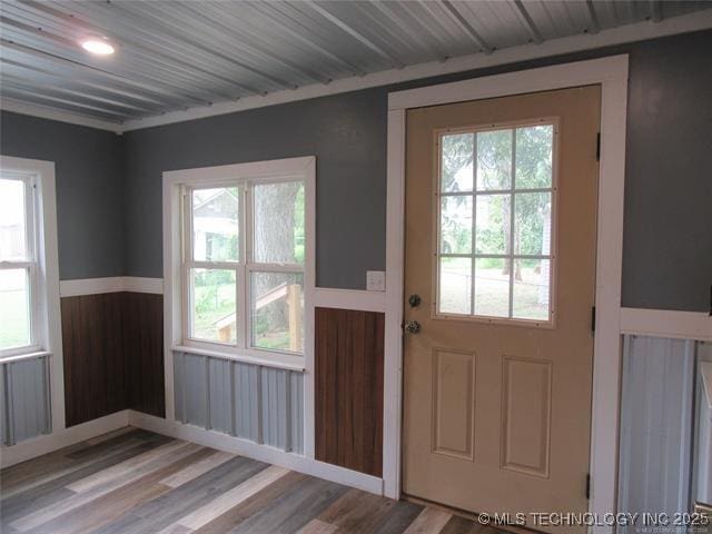 doorway with wood-type flooring