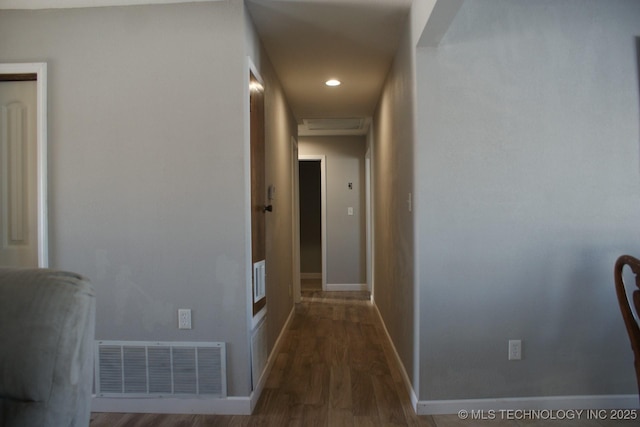 corridor featuring hardwood / wood-style floors