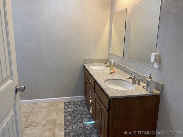 bathroom with vanity and tile patterned flooring