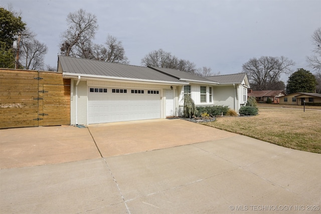 ranch-style house with a garage and a front lawn