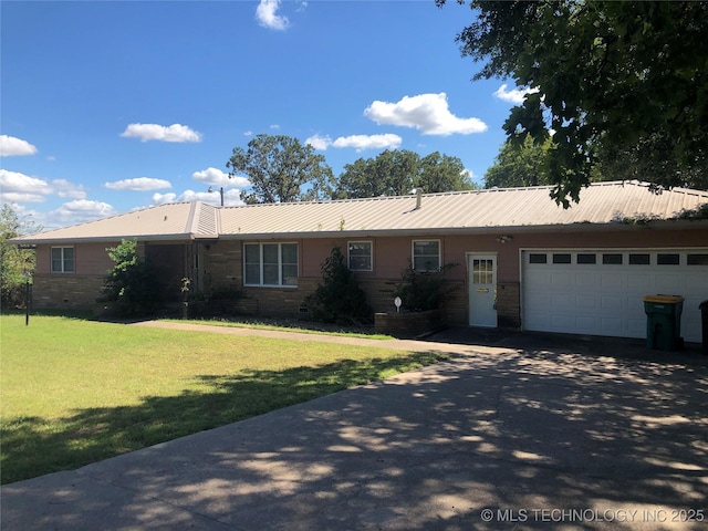 single story home with a garage and a front yard