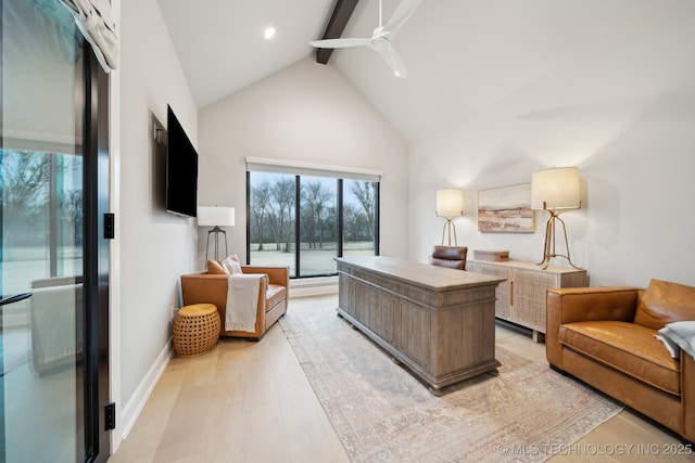 office with beam ceiling, light hardwood / wood-style flooring, high vaulted ceiling, and ceiling fan