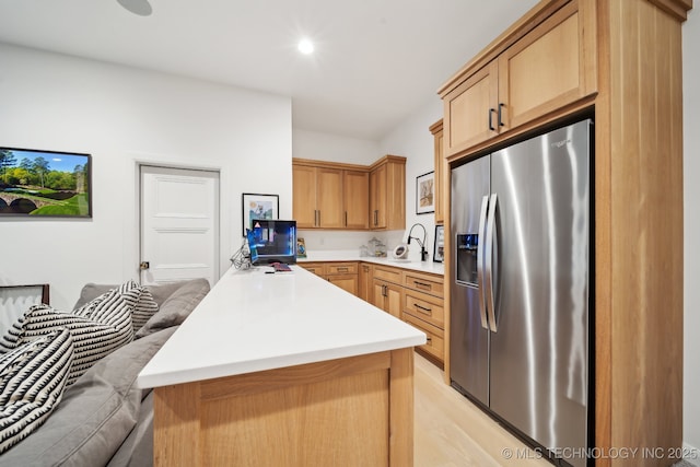 7300 E College St, Broken Arrow, OK 74014 - kitchen with stainless steel fridge with ice dispenser, light countertops, a sink, light wood finished floors, and a peninsula