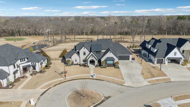 aerial view featuring a wooded view