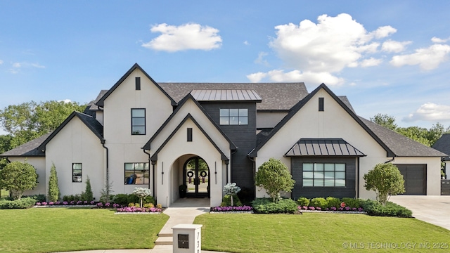 7300 E College St, Broken Arrow, OK 74014 - view of front of property with a standing seam roof, stucco siding, french doors, concrete driveway, and an attached garage