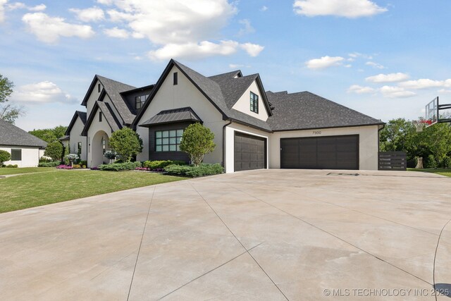7300 E College St, Broken Arrow, OK 74014 - view of front of home with stucco siding, driveway, a front yard, and an attached garage