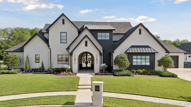 7300 E College St, Broken Arrow, OK 74014 - view of front of house featuring french doors, a standing seam roof, stucco siding, and driveway
