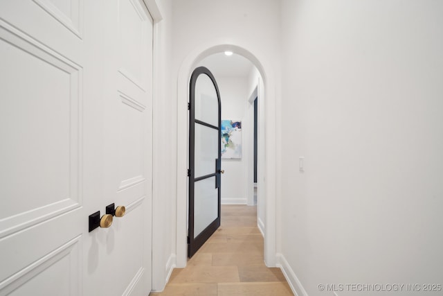 corridor featuring light hardwood / wood-style flooring