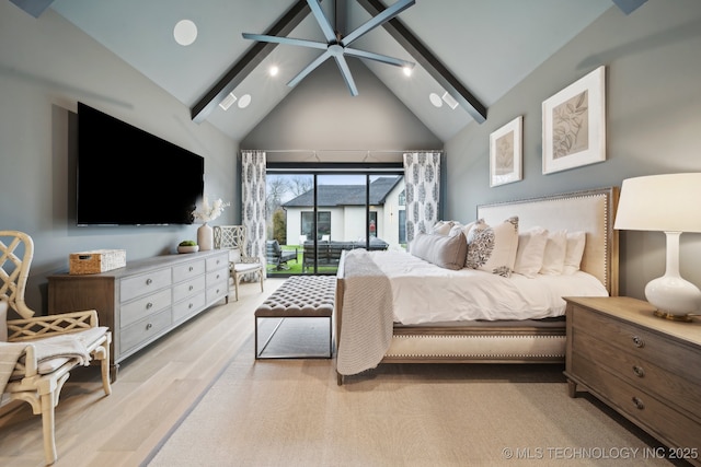 bedroom with light hardwood / wood-style floors, high vaulted ceiling, and beamed ceiling