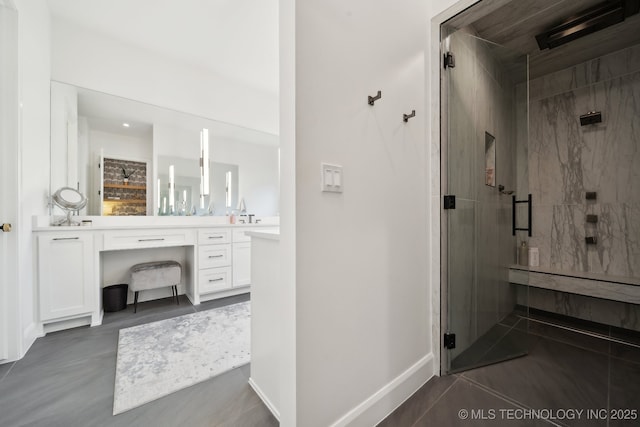 bathroom featuring vanity and a shower with door