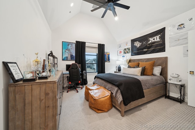 bedroom with ceiling fan, high vaulted ceiling, and light carpet