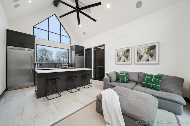 living room with high vaulted ceiling, ceiling fan, and beamed ceiling