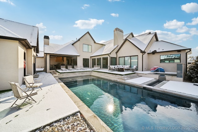 view of pool featuring a patio and an outdoor living space