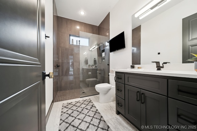7300 E College St, Broken Arrow, OK 74014 - bathroom with toilet, vanity, a walk in shower, recessed lighting, and marble finish floors