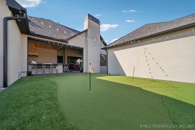 7300 E College St, Broken Arrow, OK 74014 - view of yard with a putting green