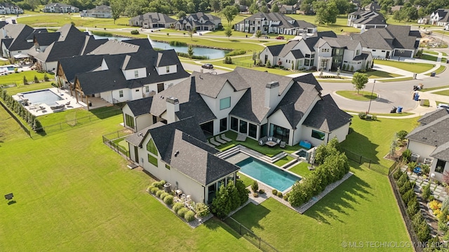 7300 E College St, Broken Arrow, OK 74014 - aerial view of residential area featuring a nearby body of water and a pool