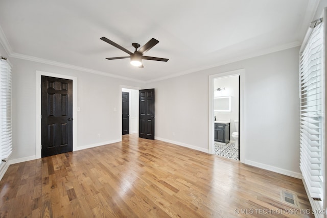 unfurnished bedroom with ensuite bath, ceiling fan, light hardwood / wood-style flooring, and crown molding