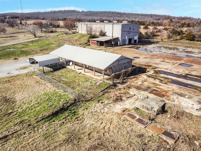 birds eye view of property with a rural view