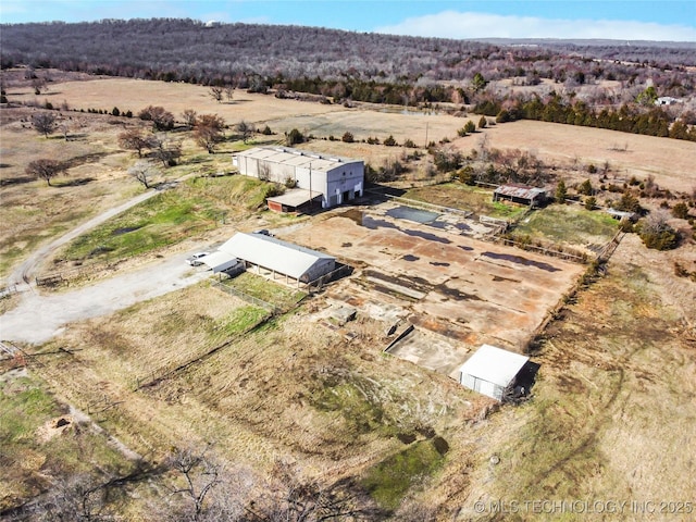 birds eye view of property featuring a rural view