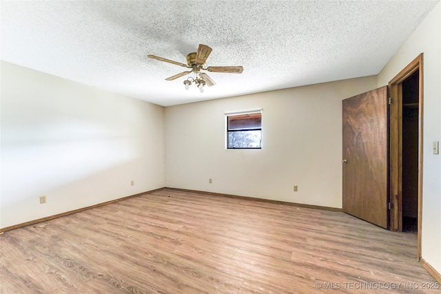 unfurnished bedroom with light hardwood / wood-style floors, ceiling fan, and a textured ceiling