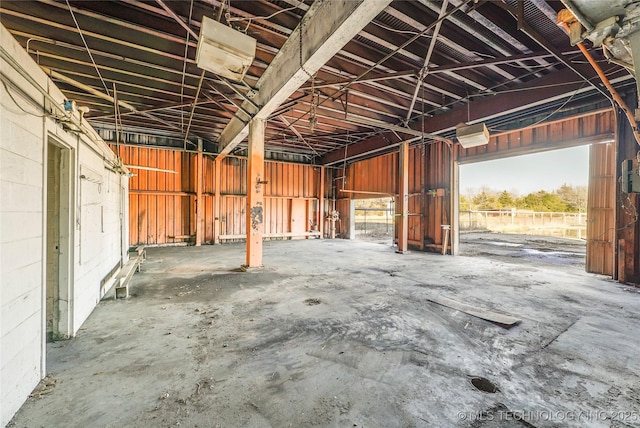 miscellaneous room featuring a healthy amount of sunlight and concrete floors