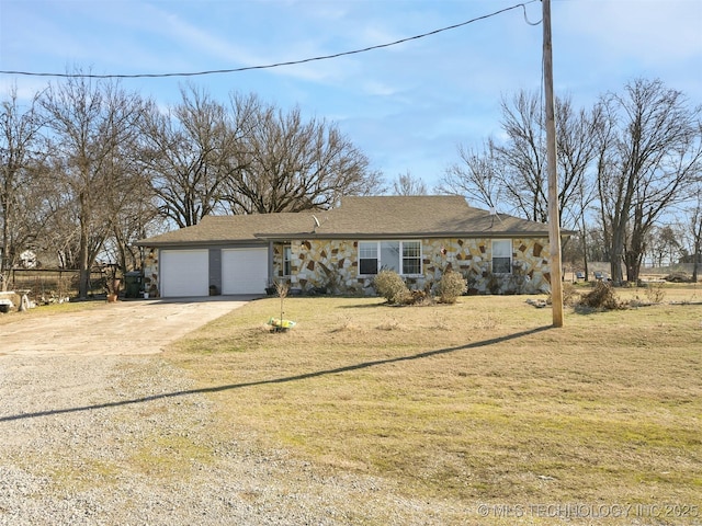 view of front of home featuring a garage and a front lawn