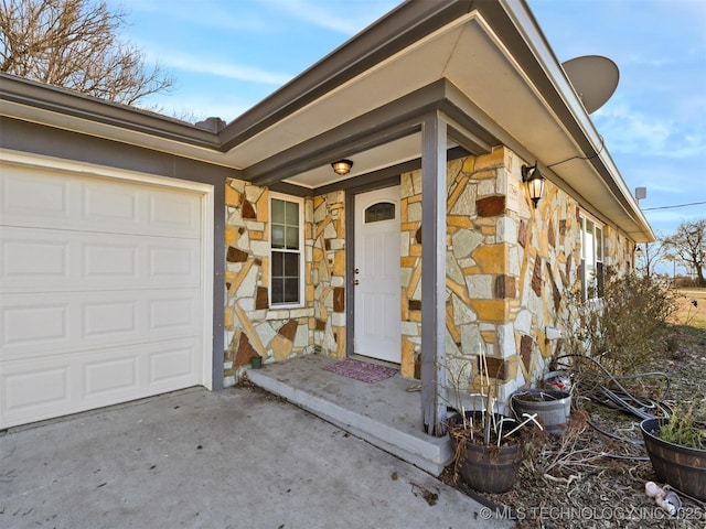 entrance to property featuring a garage