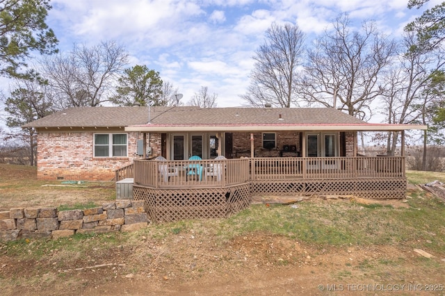 back of house featuring a deck